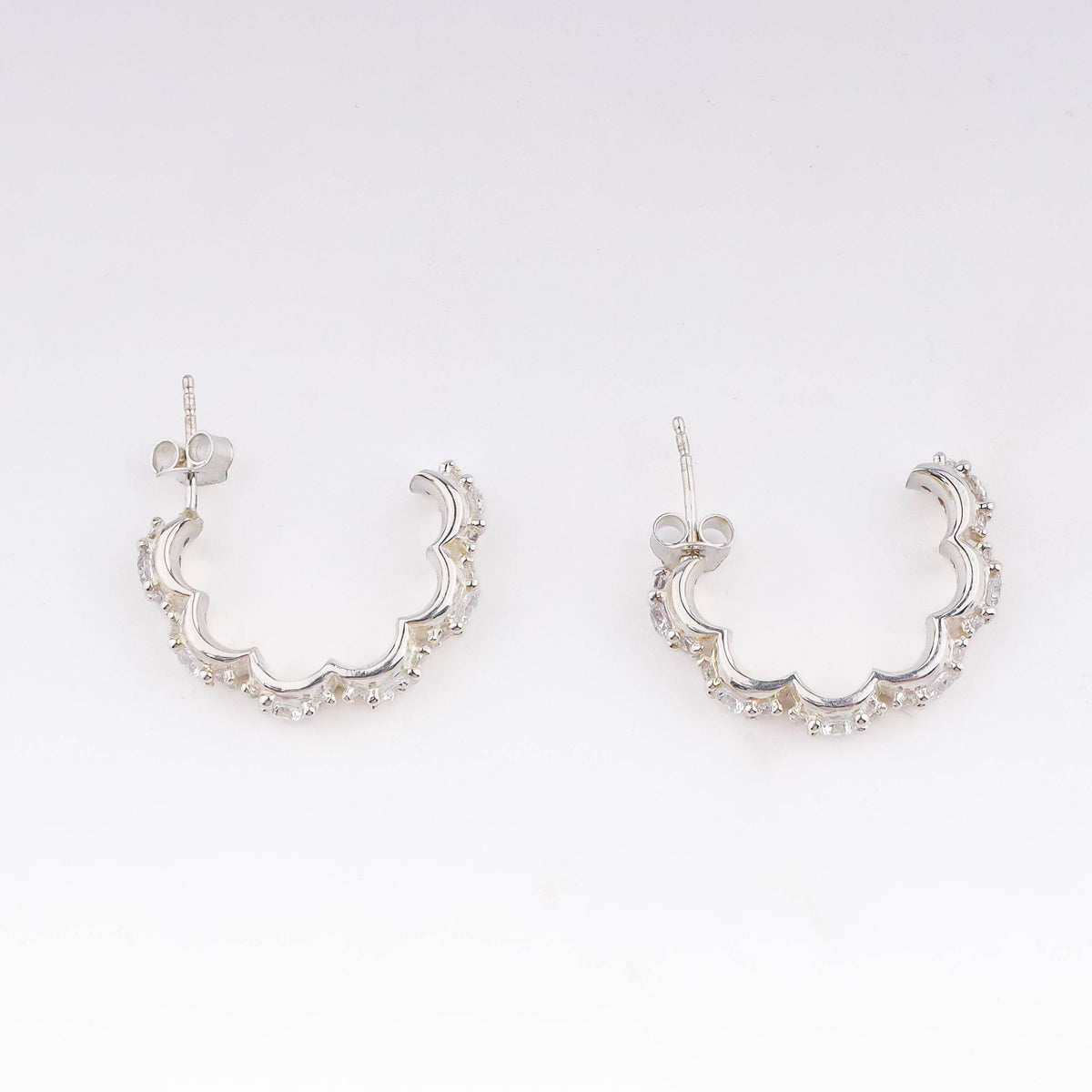Silver floral shaped hoops with CZ stones, versatile jewelry accessory