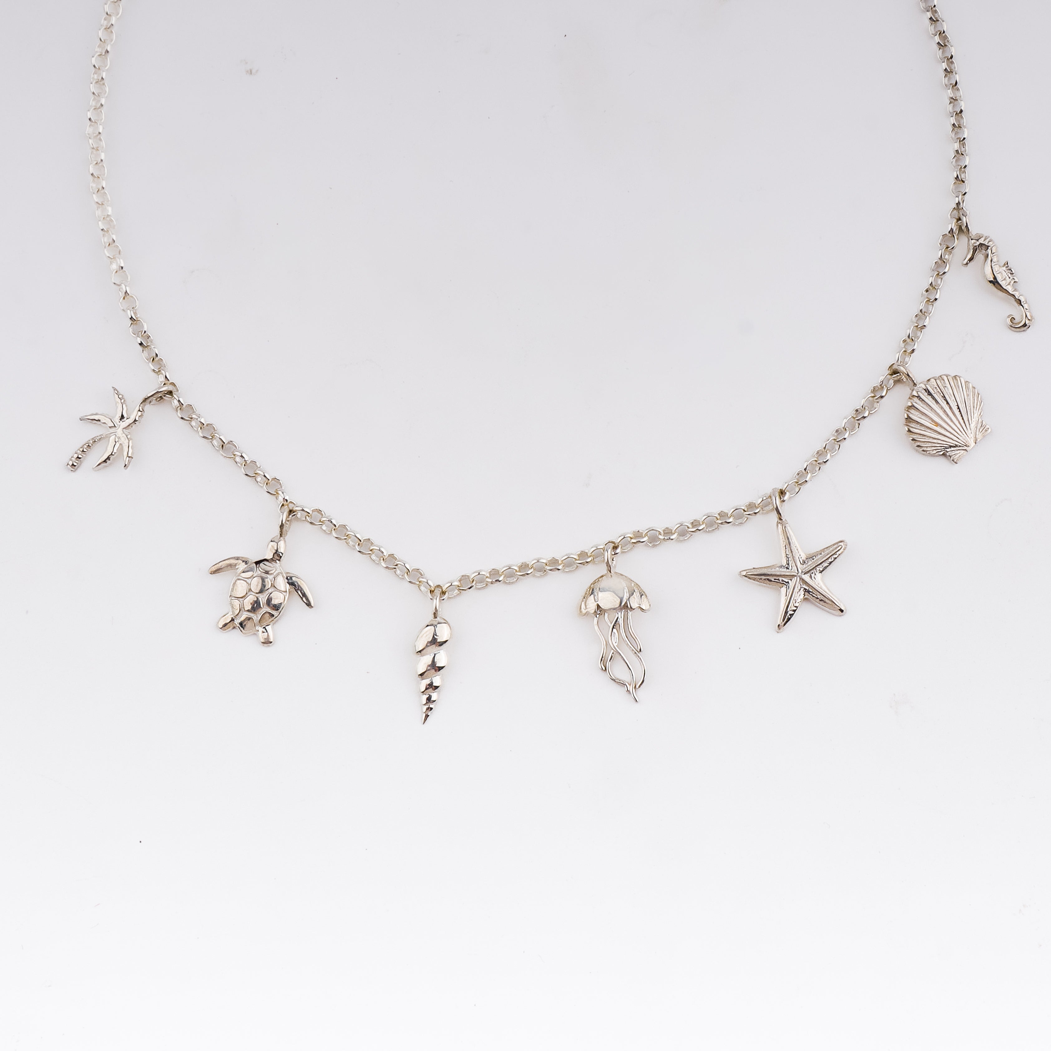 Minimal sea motif silver necklace design