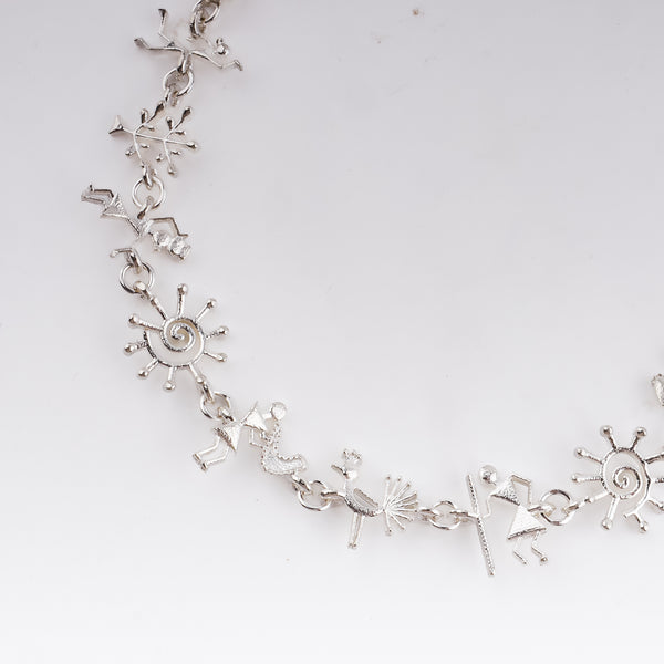 Silver Warli motif necklace showcasing handcrafted tribal art