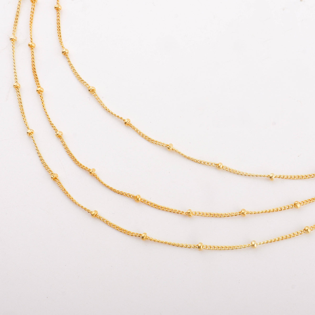 Multiple gold layered chain necklaces