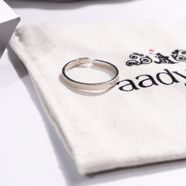Sterling silver textured ring on Aadyaa pouch