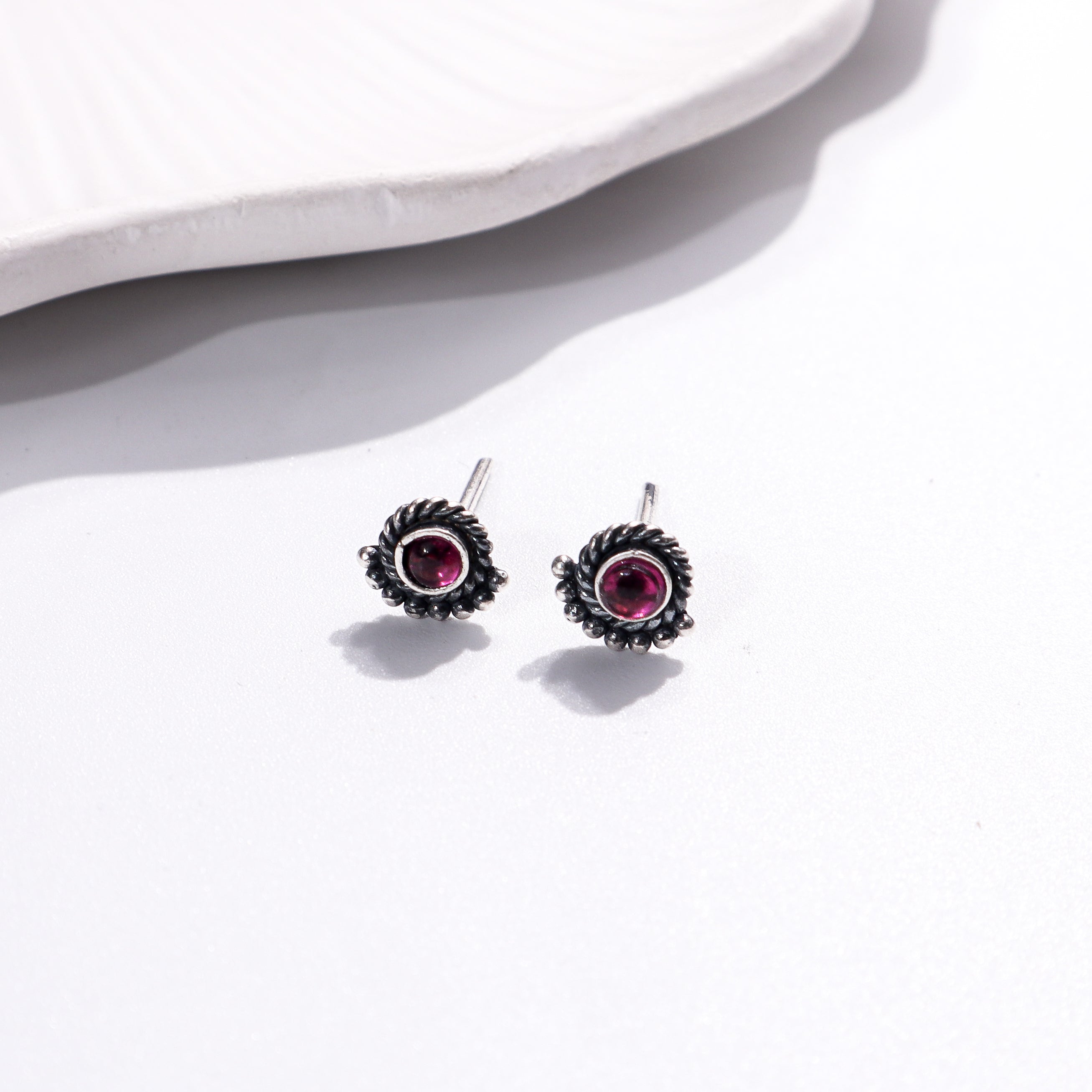 Silver earrings with pink gemstones