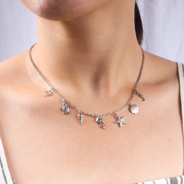 Close-up of Silver Sea Charm Necklace with charm detailing