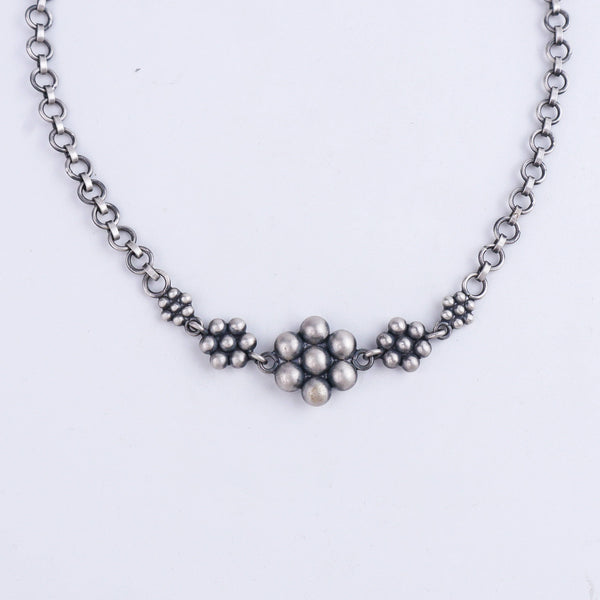 Close-up of Silver Kudi Arm Band chain with floral silver bead motifs, durable sterling silver jewelry