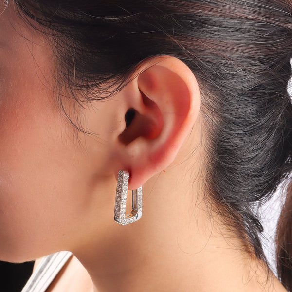 Silver CZ stone earrings worn by model