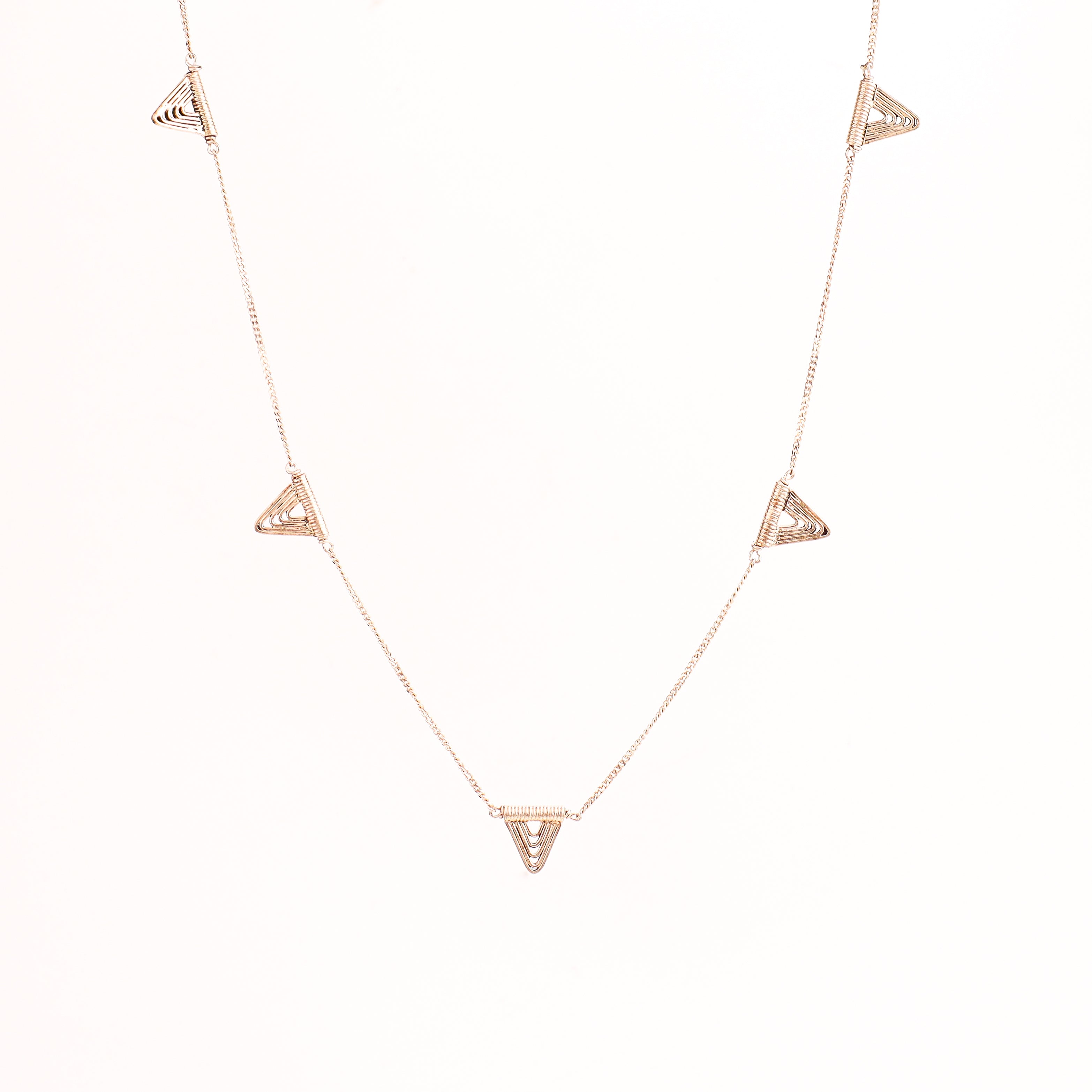 Detail shot highlighting polished silver spiral and geometric edges