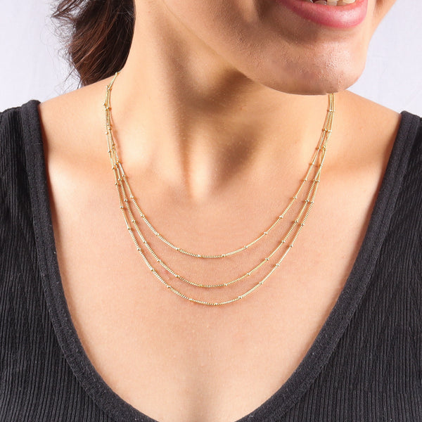 Silver beaded chain necklace on model
