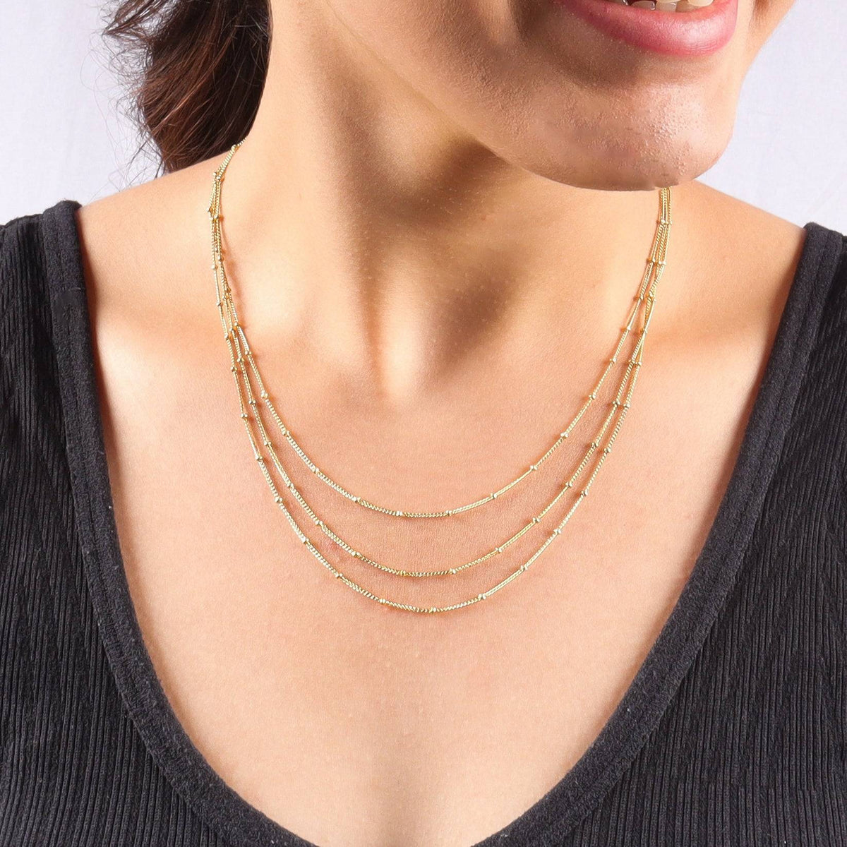 Silver beaded chain necklace on model