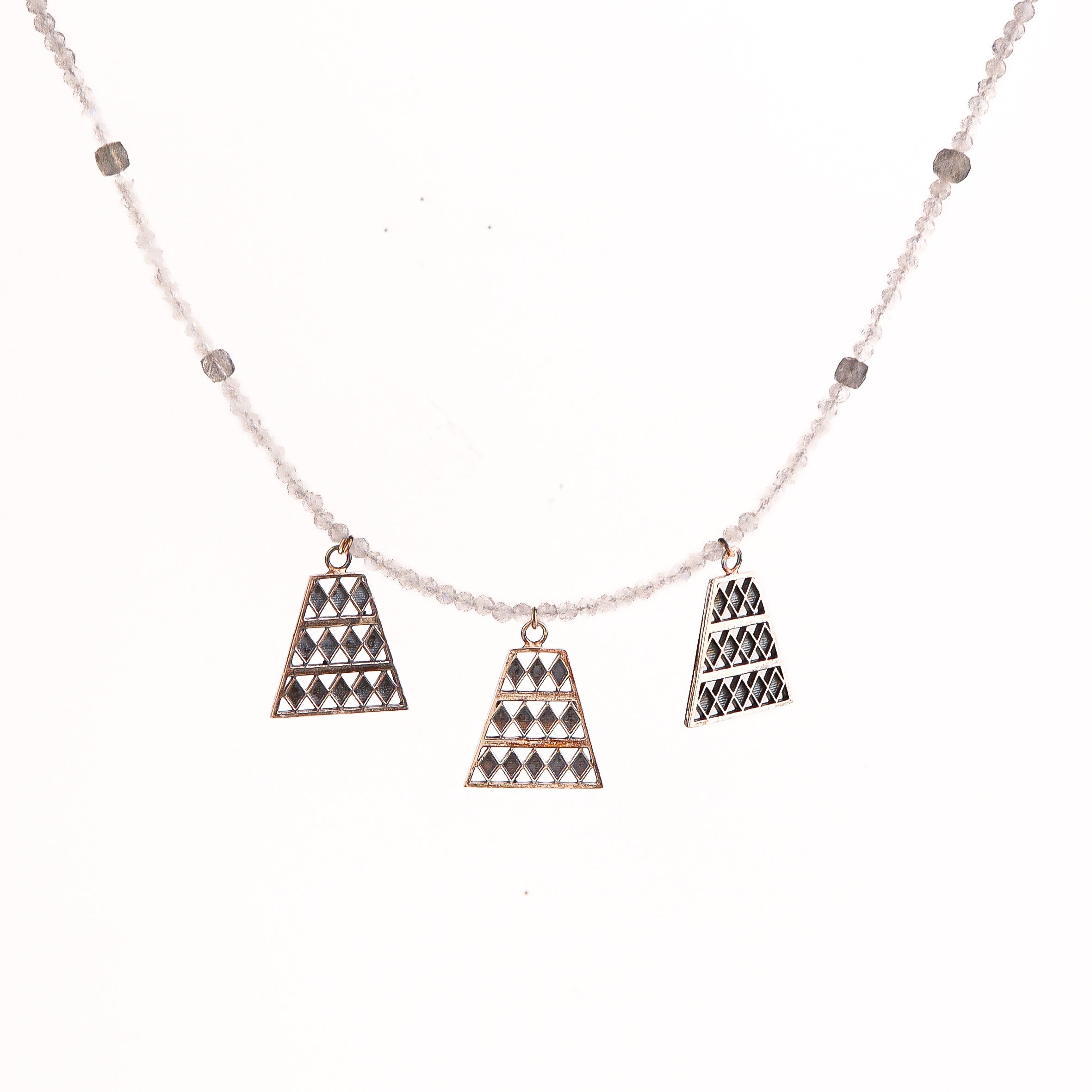 Silver trapezoid pendant necklace styled with contemporary outfit