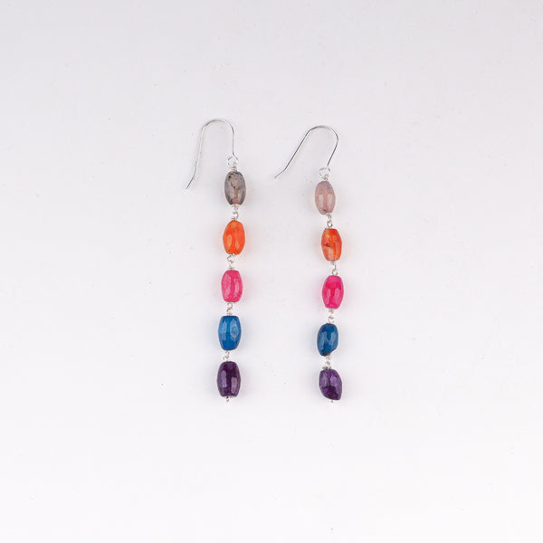 Angled side view of multicolour dangling earrings showing intricate silverwork and dangling movement