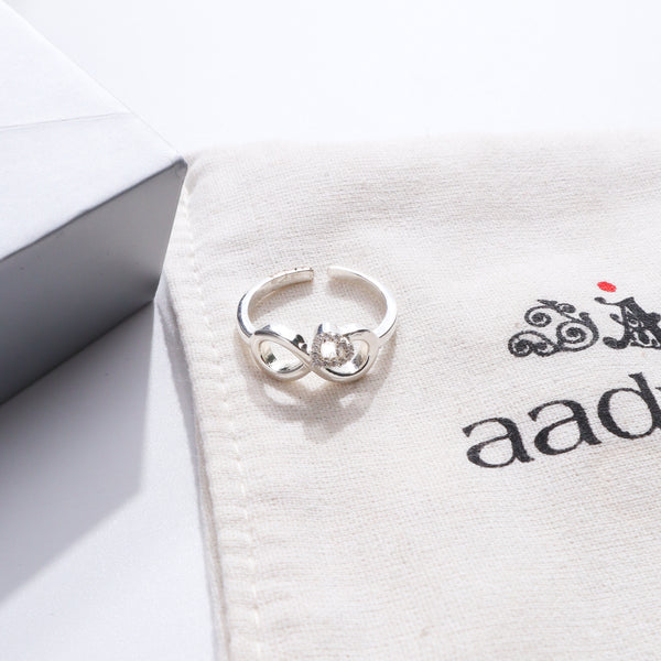 Silver CZ infinity heart ring on Aadyaa jewelry pouch