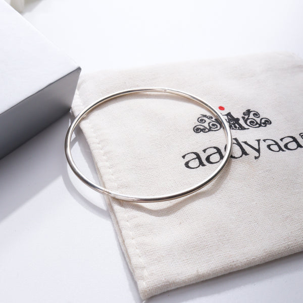 Plain Silver Bangle on Aadyaa jewelry pouch