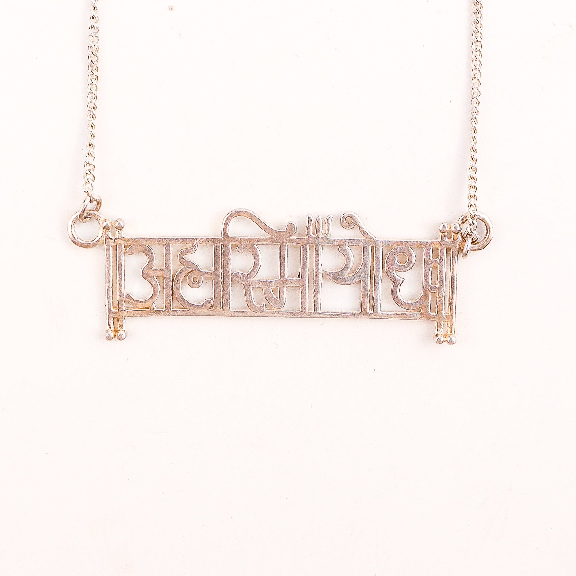 wear Ahamsmiyoddha silver necklace for modern styling