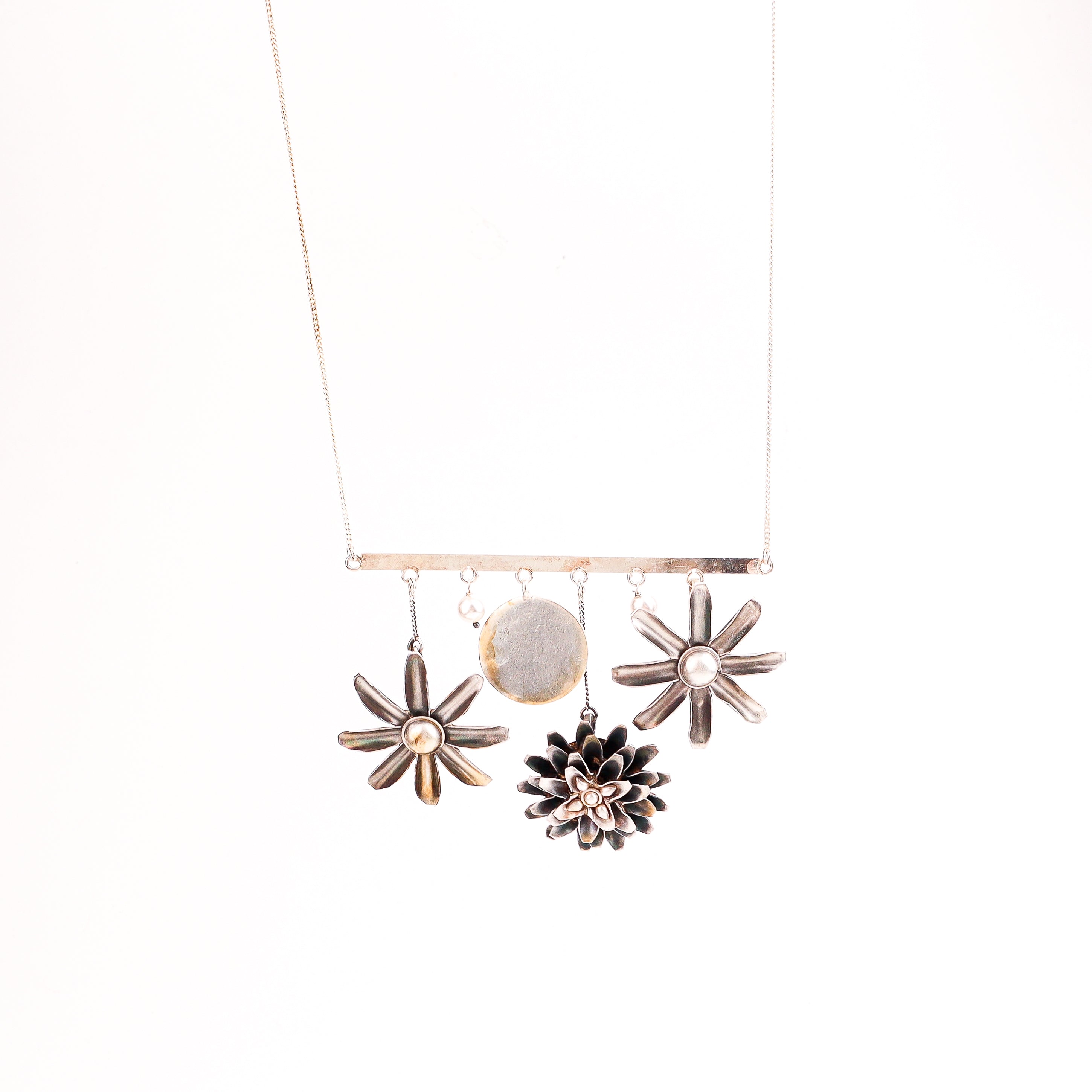 Angled side view of Silver Snowflake Filigree Earring