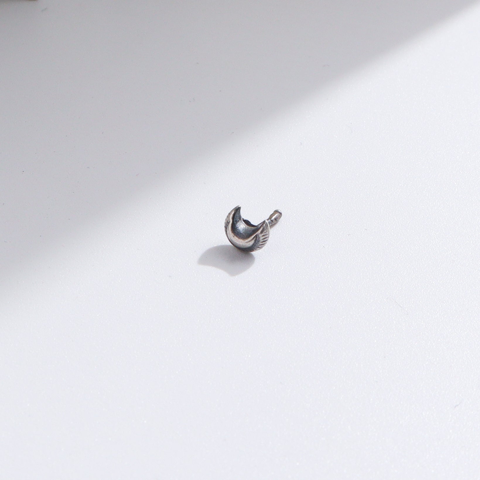 Silver Tiny Textured Chandrakor Nose Pin