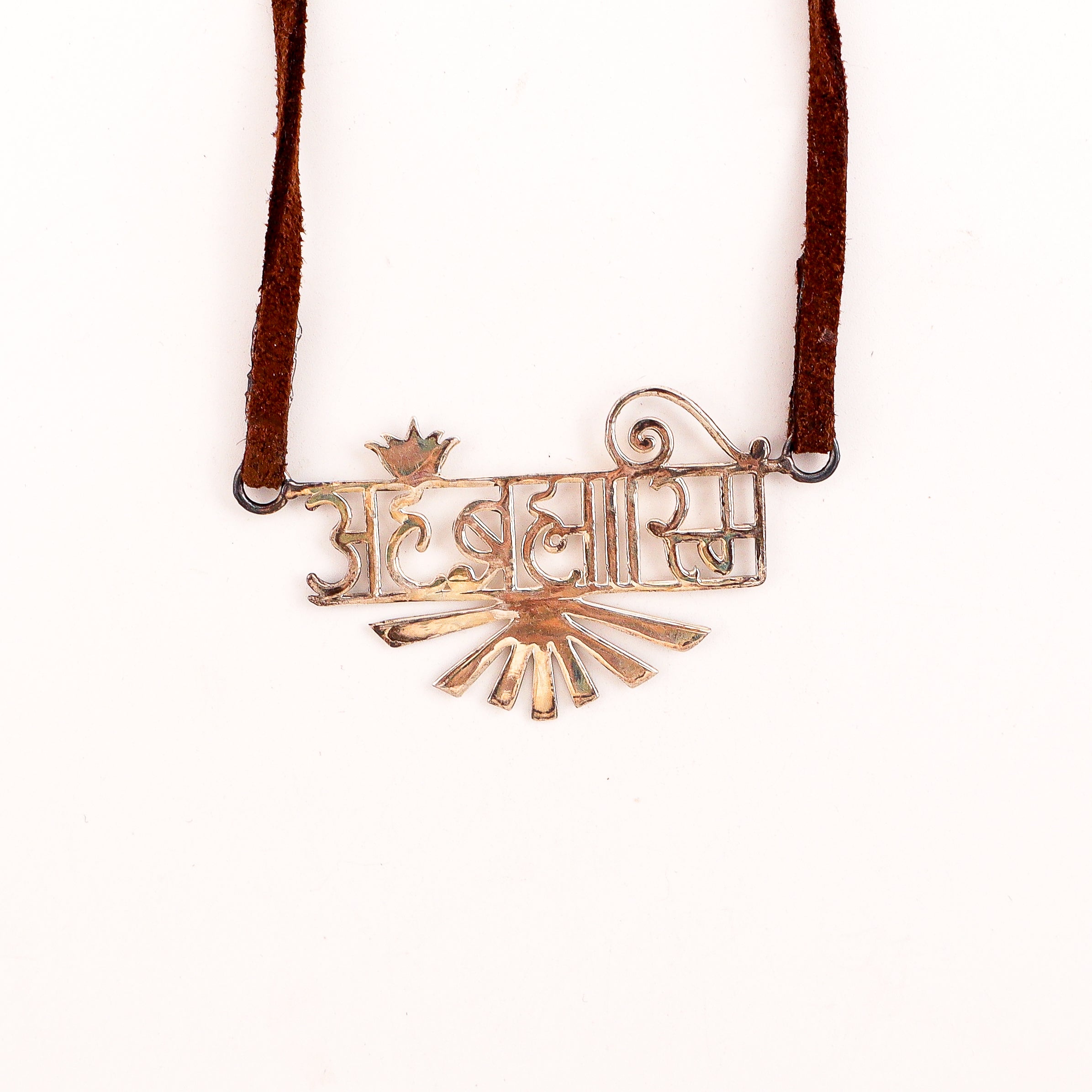 Detail shot highlighting precision-cut lettering and silver finish