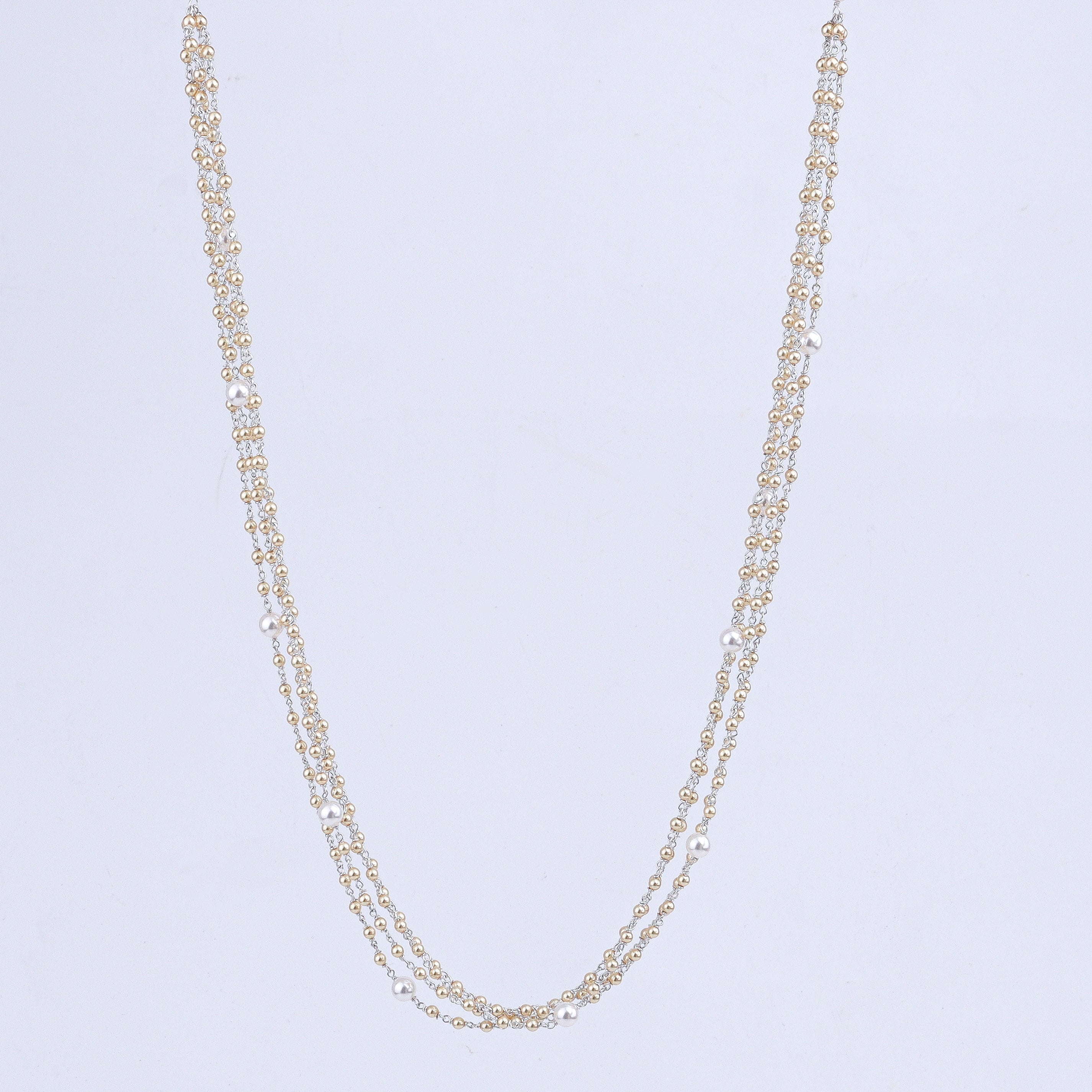 Golden and white pearl silver necklace close-up detailing