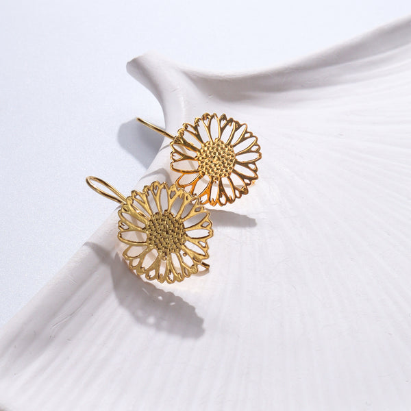 Gold floral earrings in intricate design