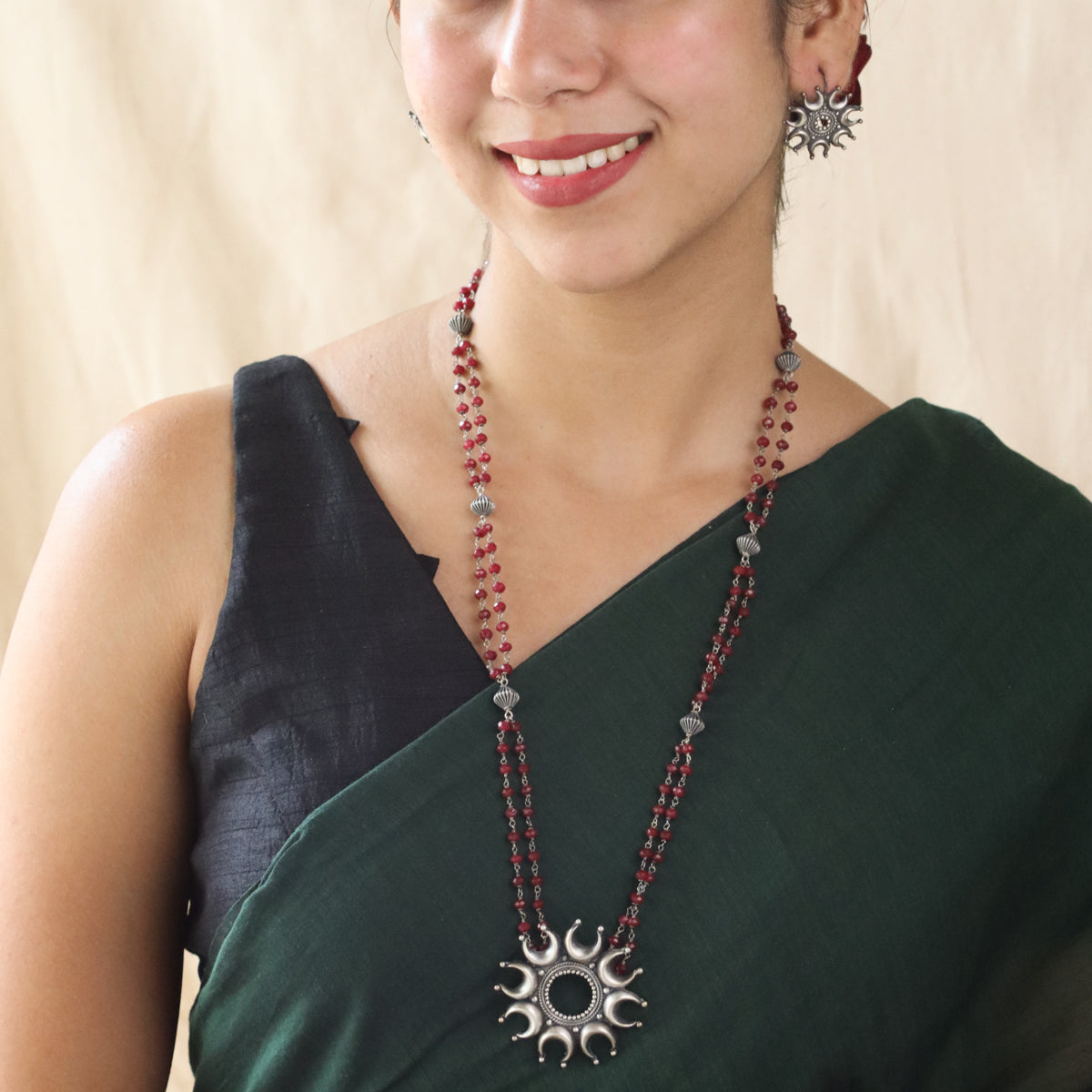 Silver Chandrakor Motif Set with Garnets