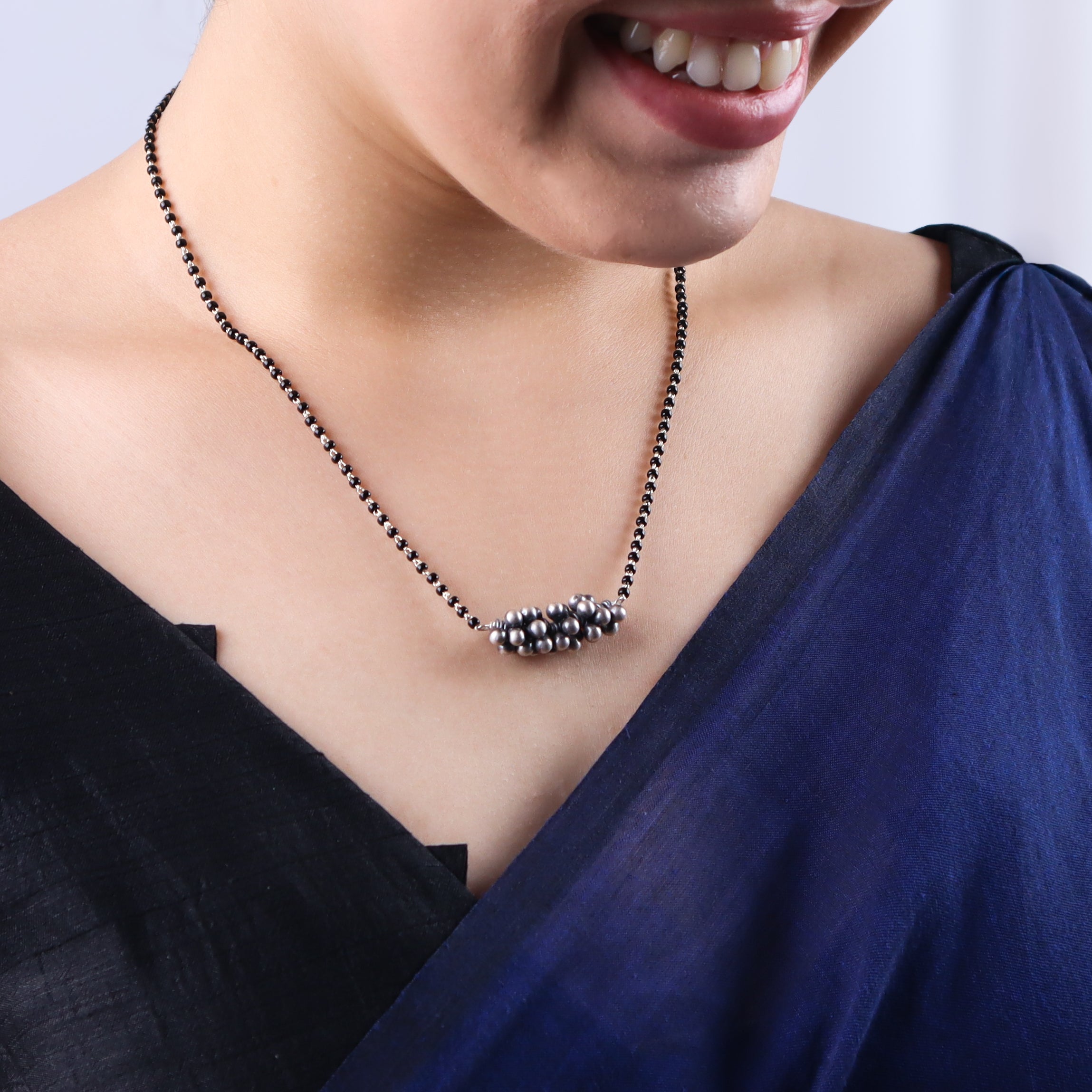 Sterling silver black bead necklace with floral cluster pendant