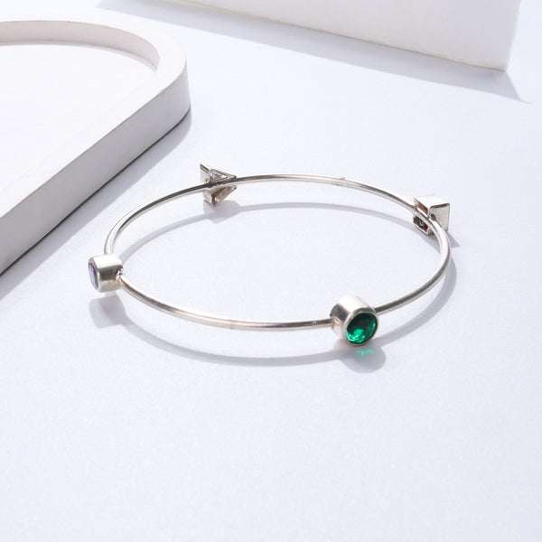 Silver bracelet with green gemstone