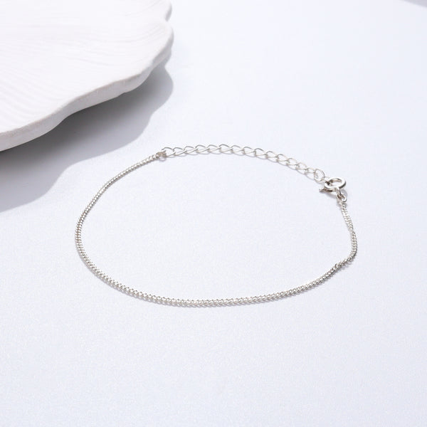 Silver chain bracelet on white background