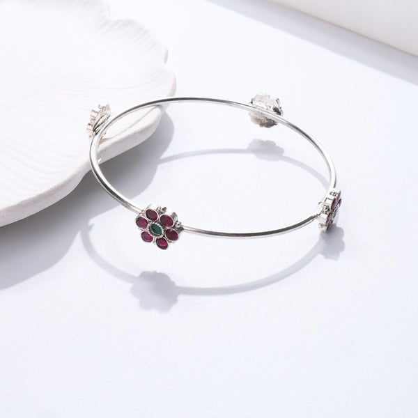 Silver bangle with pink and green floral design