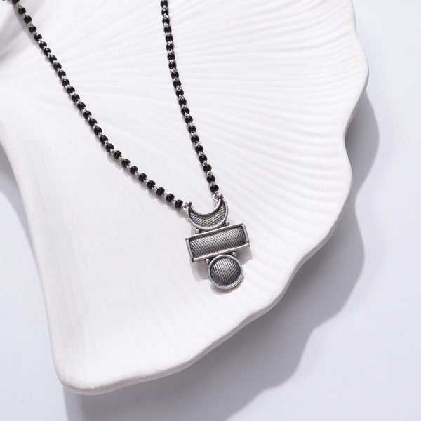 Silver Chandrakor Tikli Mangalsutra with black beads and silver accents