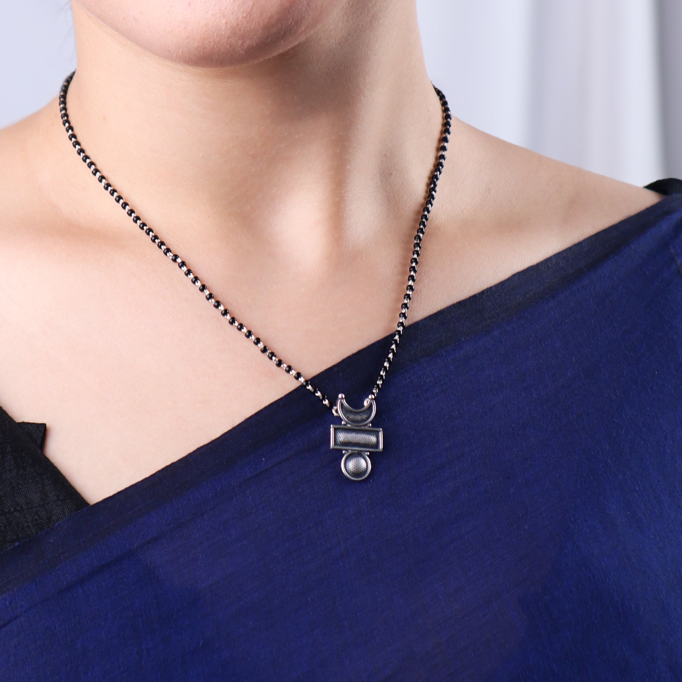 Silver Chandrakor Tikli Mangalsutra necklace on model