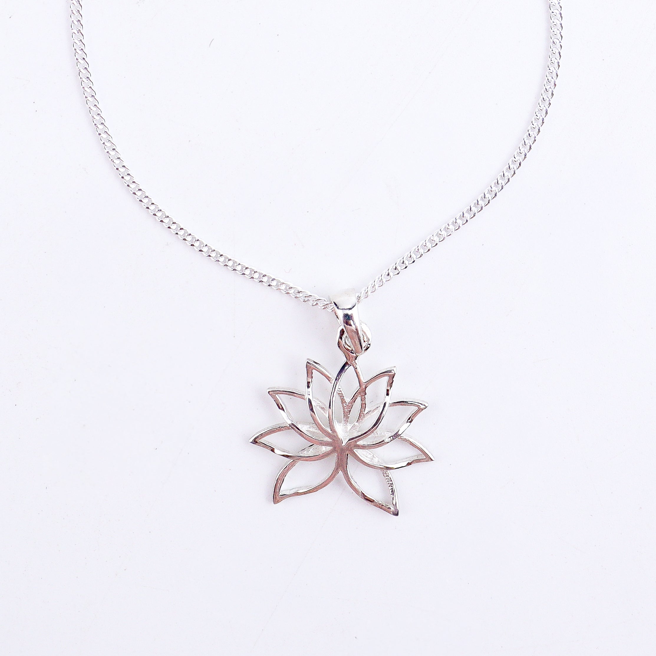wear lotus charm necklace for everyday styling