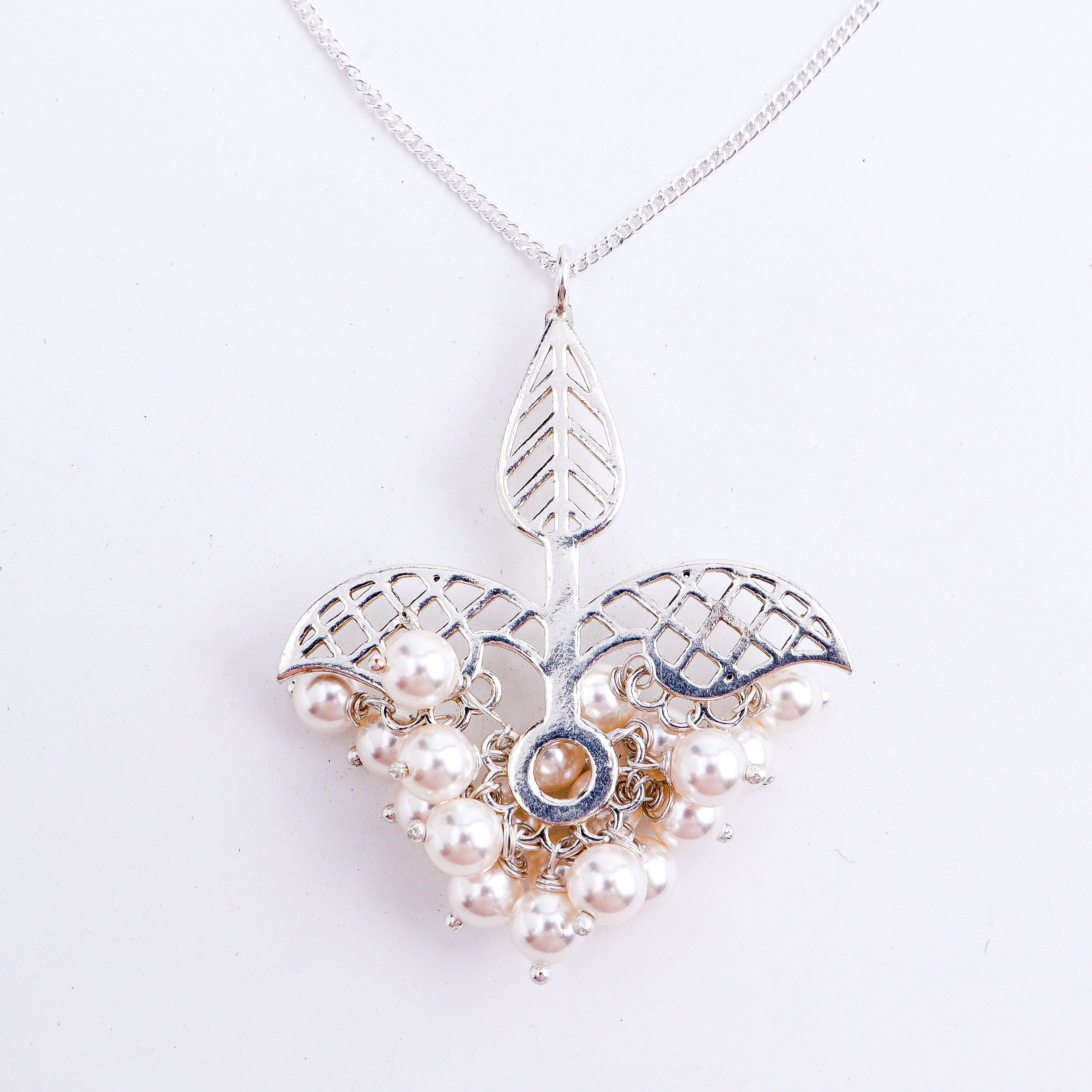 wear silver leaf filigree shiny necklace for festive styling