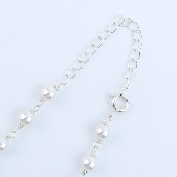 Woman styling 92.5 silver pearl Ganthan necklace with traditional or contemporary outfit