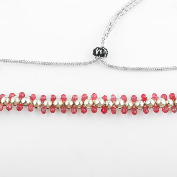 Detail shot of silver bead thushi pattern and quartz accents