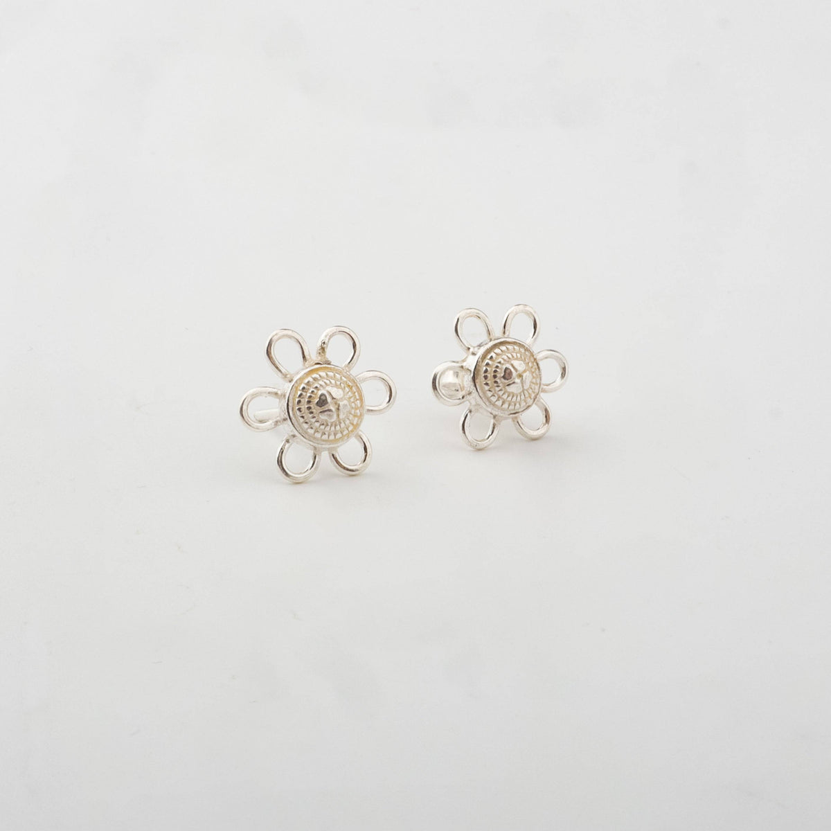 Silver charm earrings with floral design