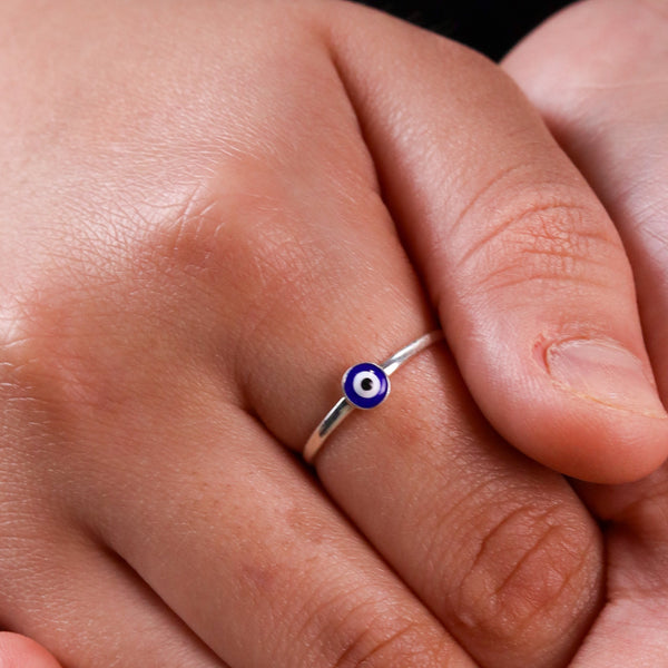 Close-up of silver evil eye ring