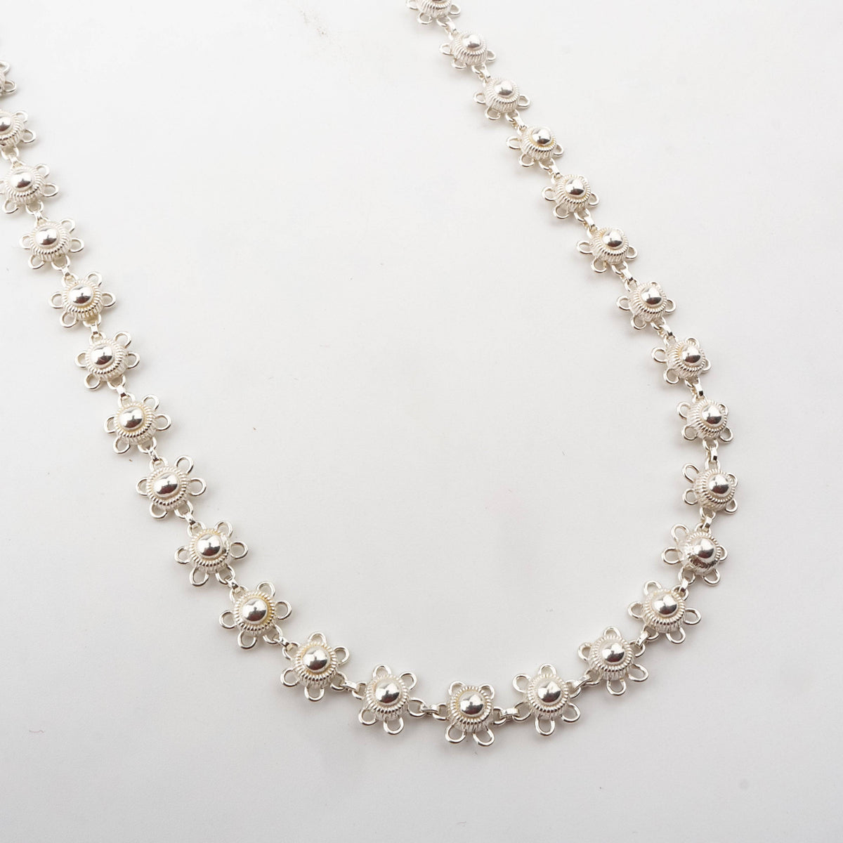Silver floral charm necklace