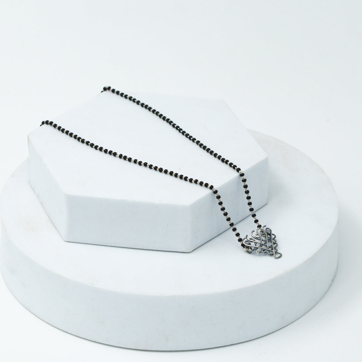 style silver Saraswati mangalsutra with modern outfit