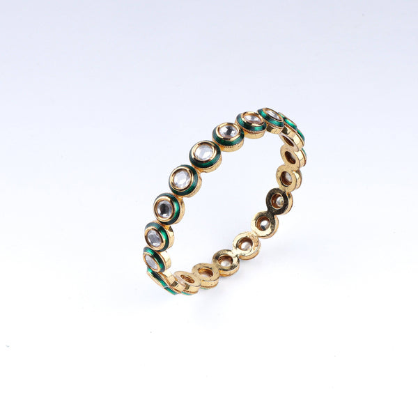 Angled view of a 22K gold-plated fashion bangle (single) highlighting its elegant structure, unique design, and polished gold finish