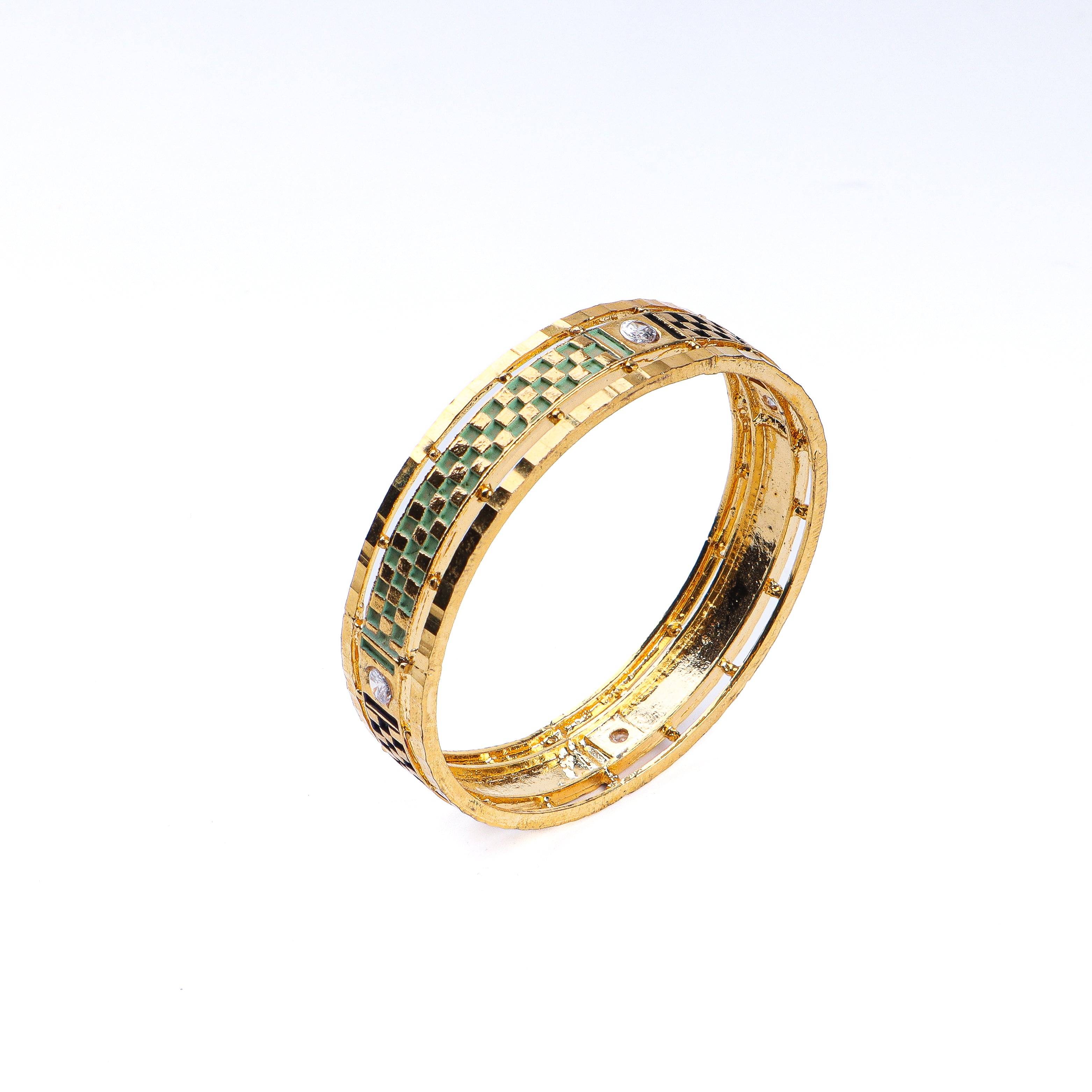 Angled view of a 22K gold-plated fashion bangle (single) highlighting its elegant structure and polished gold finish