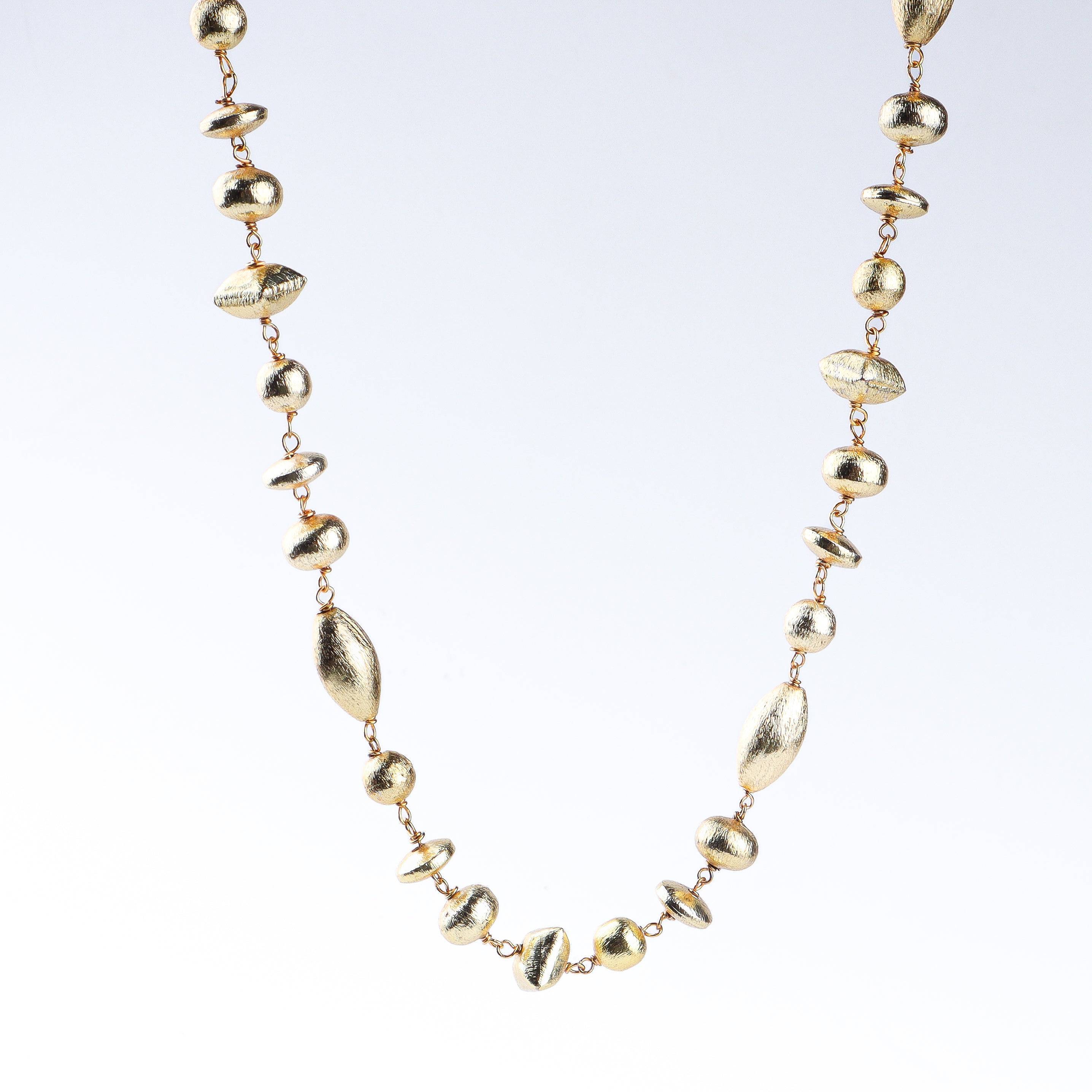 Detailed view of 22K gold-plated fashion necklace highlighting intricate motifs, textured detailing, and premium 22K gold-plated finish