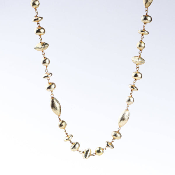 Detailed view of 22K gold-plated fashion necklace highlighting intricate motifs, textured detailing, and premium 22K gold-plated finish