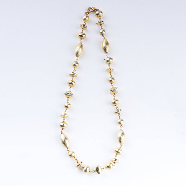 Close-up of 22K gold-plated fashion necklace showcasing intricate detailing, fine craftsmanship, and rich 22K gold plating