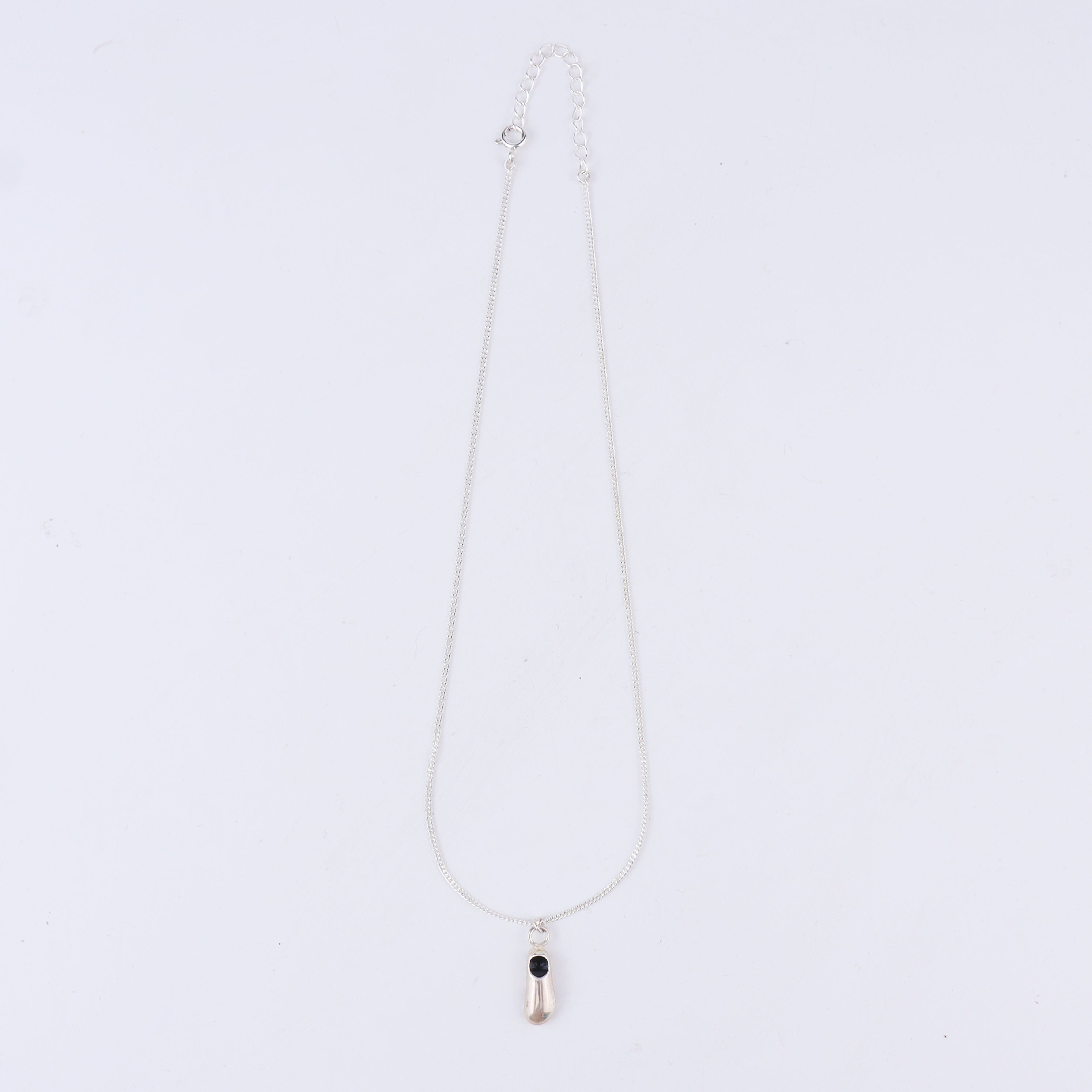 Flat-lay shoe pendant necklace