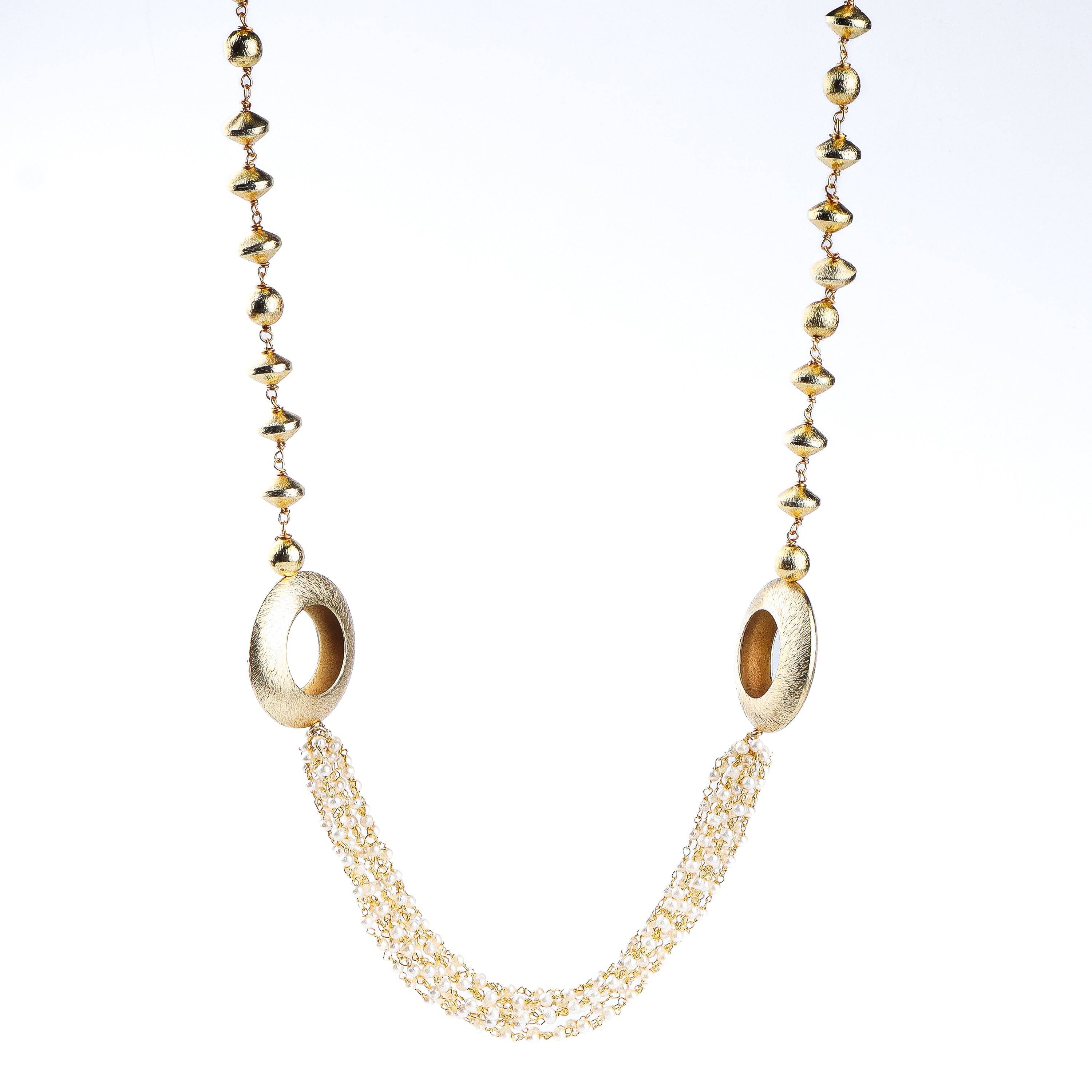 Flat-lay of a 22K gold-plated fashion necklace with complementary gold-plated jewelry and elegant accessories