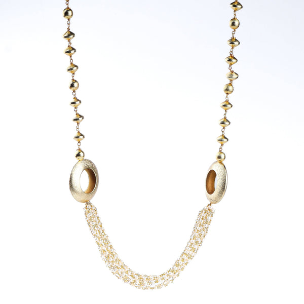 Flat-lay of a 22K gold-plated fashion necklace with complementary gold-plated jewelry and elegant accessories
