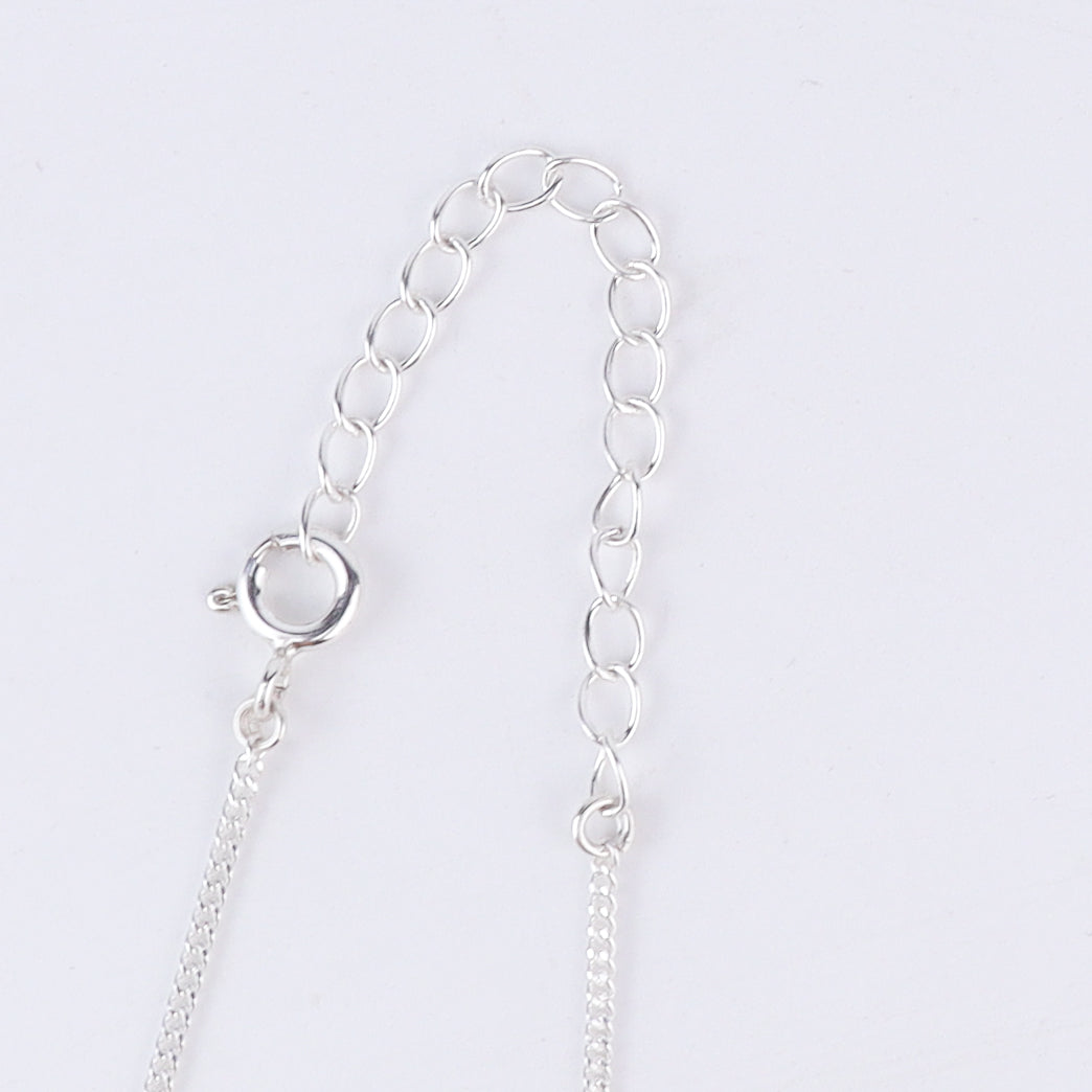 Shoe silver pendant styled with modern outfit