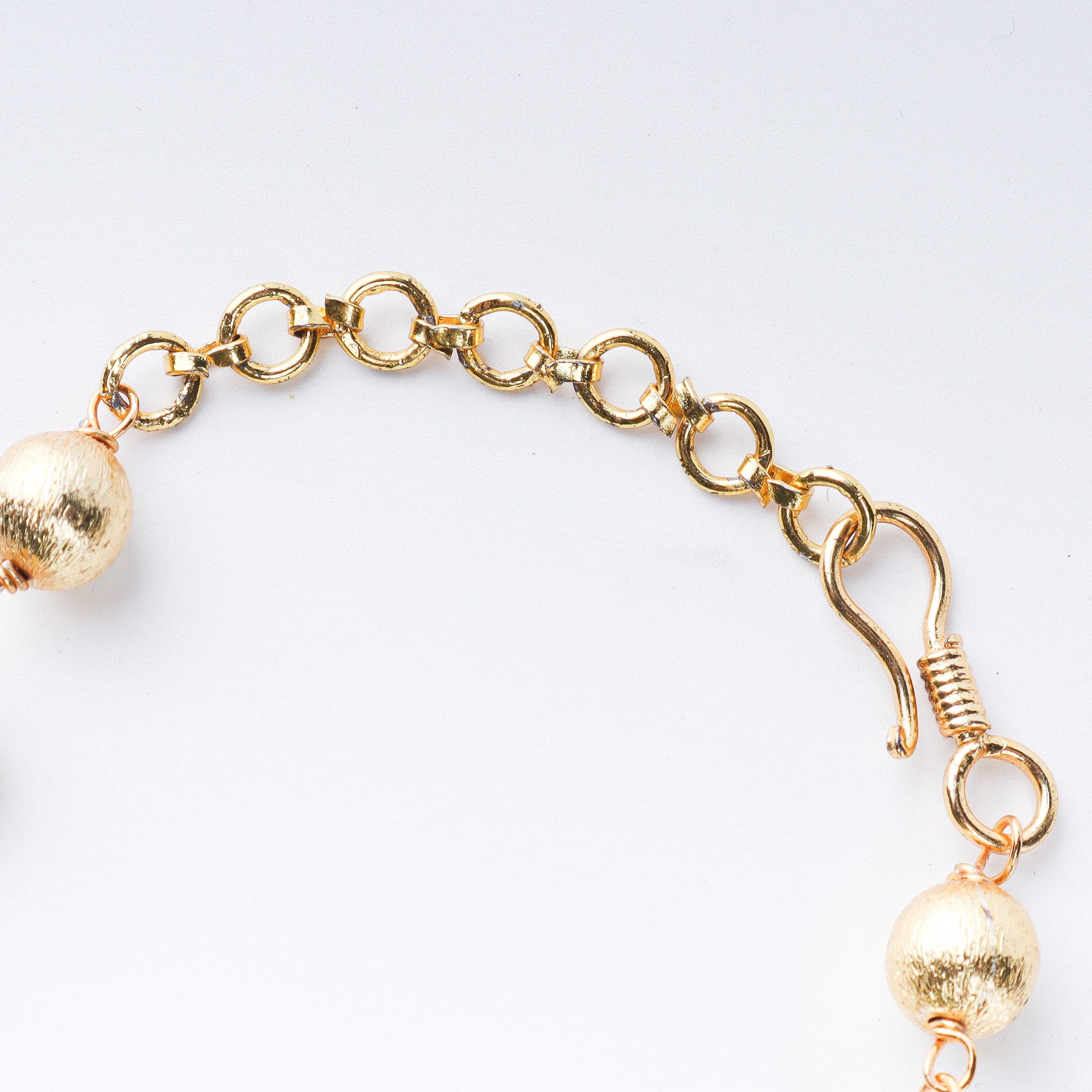 Angled view of 22K gold-plated fashion necklace highlighting its elegant structure, design, and polished gold finish