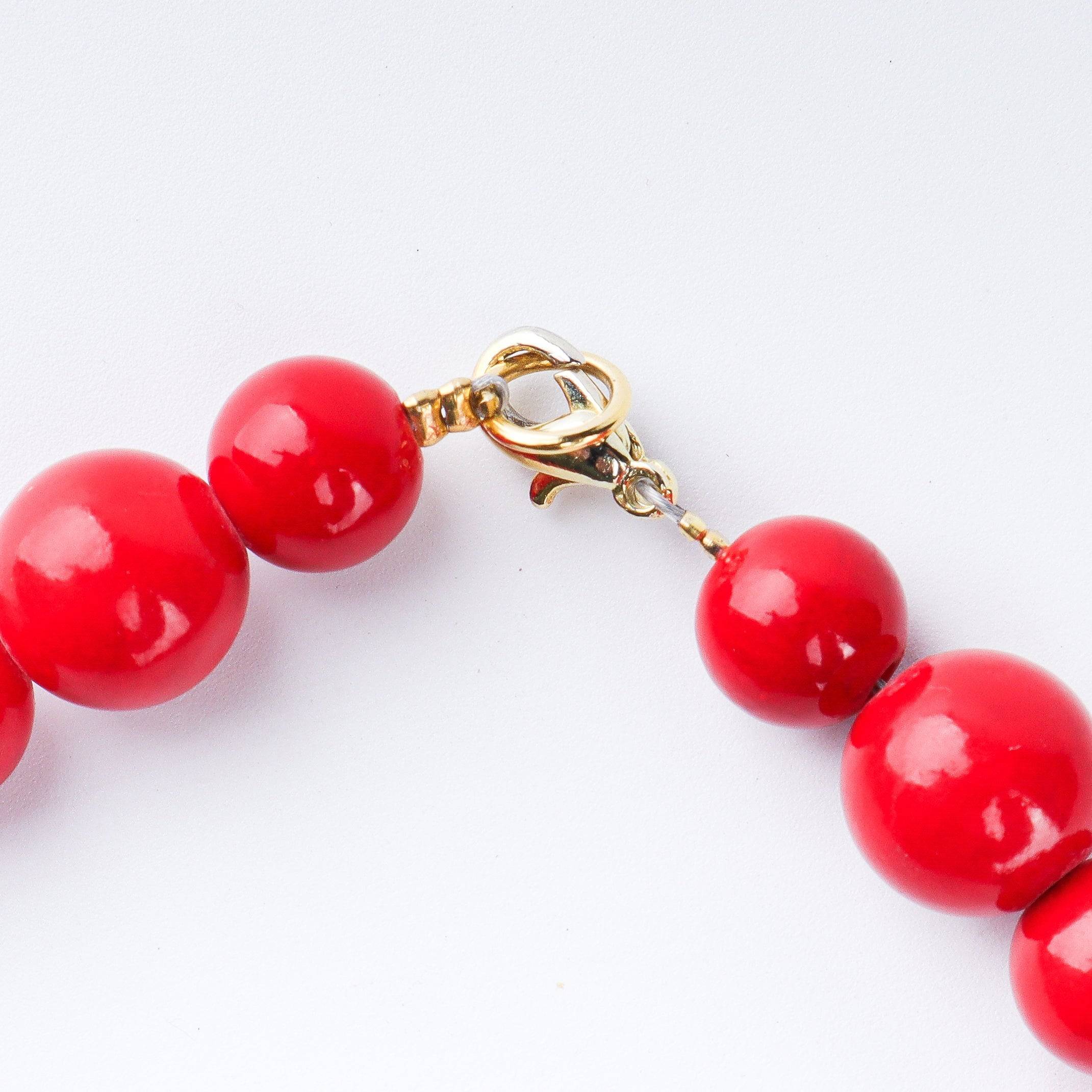 Angled view of a 22K gold-plated fashion necklace highlighting its elegant structure, design, and polished gold finish