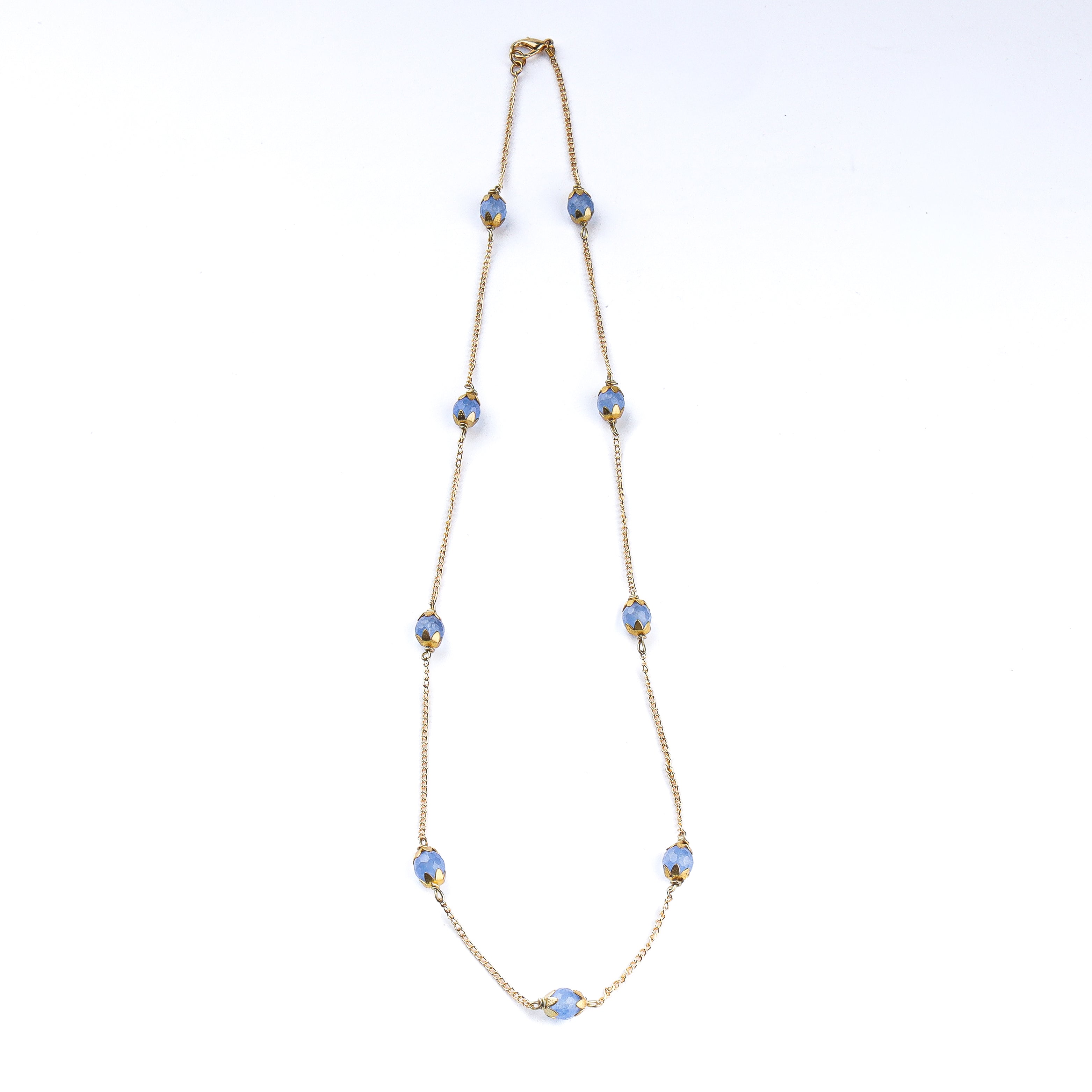 Detailed view of a 22K gold-plated fashion necklace highlighting intricate motifs, textured detailing, and premium 22K gold-plated finish