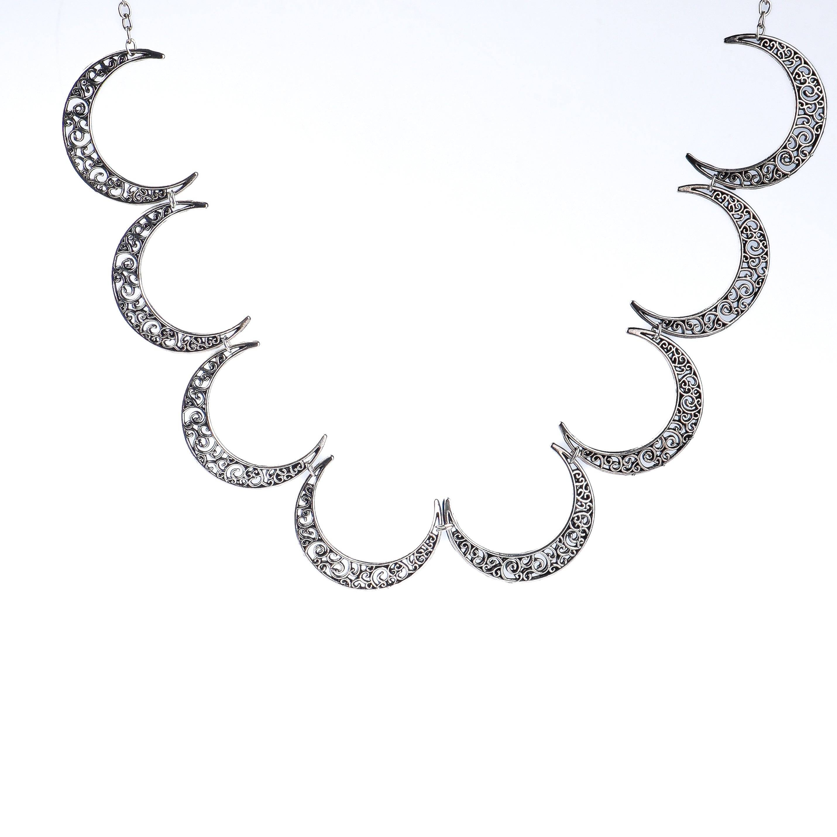 Flat-lay of a 22K gold-plated fashion necklace with complementary gold-plated jewelry and elegant accessories